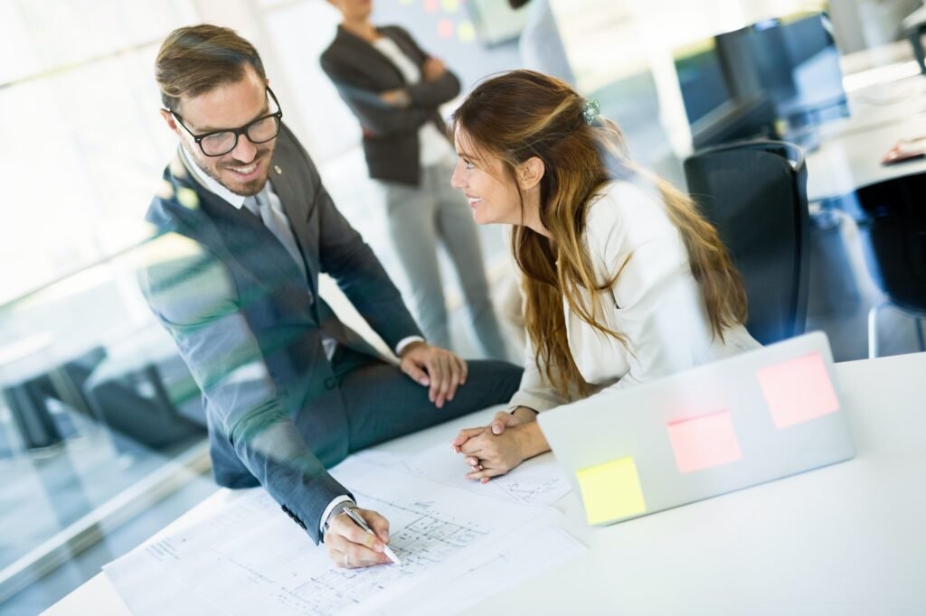 Picture of young architects discussing in office